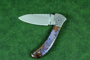 "Starling" fine handmade custom folding knife, obverse side view in high molybdenum stainless steel blade, engraved stainless bolsters, faceted amethyst gemstone accents and Rio Grande Agate handle "Starling" fine handmade custom folding knife, obverse side view in high molybdenum stainless steel blade, engraved stainless bolsters, faceted amethyst gemstone accents and Rio Grande Agate handle