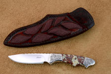 "Thuban" obverse side view in CPM154CM powder metal technology high molybdenum stainless steel blade, hand-engraved 304 stainless steel bolsters, Brecciated Jasper gemstone handle, hand-carved leather sheath inlaid with rayskin