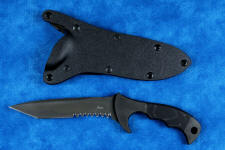 "Uvhash" tactical knife, obverse side view in T4 cryogenically treated ATS-34 high molybdenum martensitic stainles steel blade, 304 austenitic stainless steel bolsters, gray/black Micarta phenolic handle, positively locking sheath in kydex, black oxide stainless steel, 6AL4V anodized titanium, anodized aluminum