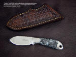 "Firefly"obverse side view in ATS-34 high molybdenum stainless steel blade, 304 stainless steel bolsters, Larvikite gemstone handle, hand-stamped leather sheath