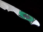 Black and green canvas reinforced micarta handle material, polished and smooth. The colors are deeper and richer when the micarta is polished verses bead blasted