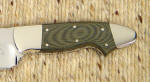 Polished, smooth, green linen micarta is darker than when bead blasted