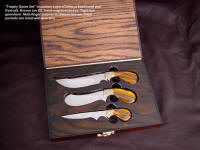 "Trophy Game Set" in case of imbuya and red oak. Knives are D2, hand-engraved brass, tiger eye gemstone handles