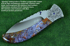 "Starling" fine handmade custom folding knife in T3 deep cryogenically treated ATS-34 high molybdenum martensitic stainless steel blade, hand-engraved 304 stainless steel bolsters, differentially anodized 6AL4V titanium liners, Rio Grande Agate gemstone handle, blue amethyst faceted gemstones set in 304 stainless steel fasteners and fittings